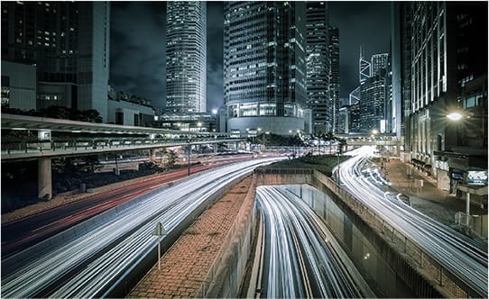 Condor Technologies - A city street illuminated at night Integrated Systems Solutions